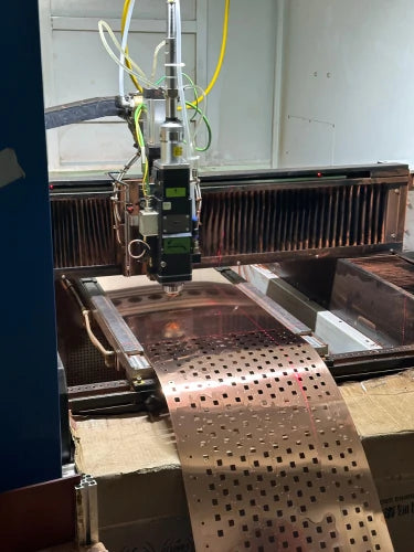 Advanced laser cutting of copper sheets at Wellgo, used for creating high-performance busbars in energy storage and power systems.